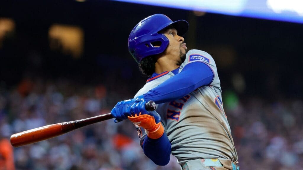 Jul 25, 2025; San Francisco, California, USA; New York Mets shortstop Francisco Lindor (12) hits a home run during the third inning against the San Francisco Giants at Oracle Park. Mandatory Credit: