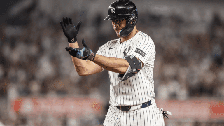 Jul 30, 2025; Bronx, New York, USA; New York Yankees designated hitter Giancarlo Stanton (27) celebrates after hitting an RBI single in the eighth inning against the Tampa Bay Rays at Yankee Stadium.