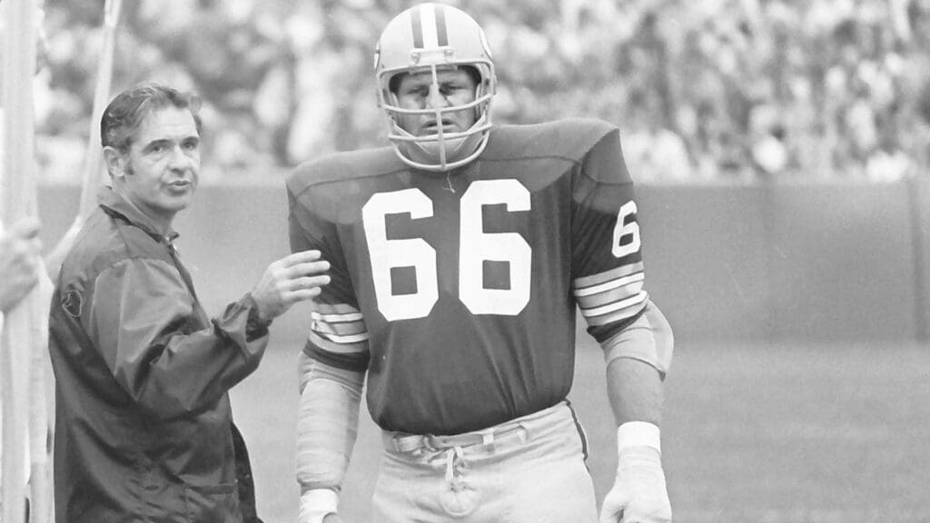 Green Bay Packers linebacker Ray Nitschke (66) speaks with head coach Dan Devine during a 20-14 loss to the Oakland Raiders on Sept. 24, 1972 at Lambeau Field in Green Bay, Wisconsin.