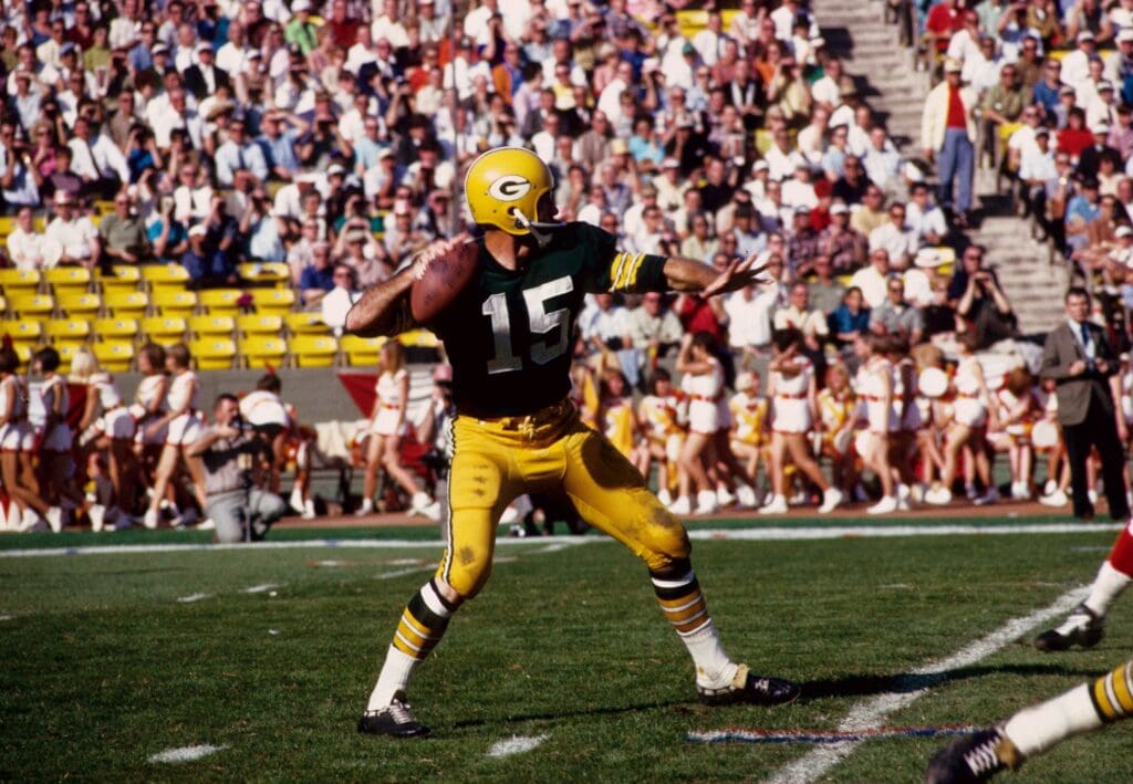 Jan 15, 1967; Los Angeles, CA, USA; FILE PHOTO; Green Bay Packers quarterback (15) Bart Starr in action against the Kansas City Chiefs during Super Bowl I at The Coliseum. The Packers defeated the Chiefs 35-10 to win the first meeting of the AFL versus the NFL for the world championship.
