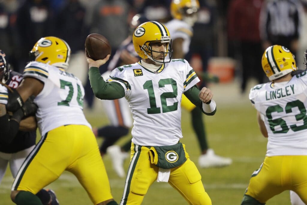 Jan 3, 2021; Chicago, IL, USA; Green Bay Packers quarterback Aaron Rodgers (12) passes against the Chicago Bears during their football game Sunday, January 3, 2021, at Soldier Field in Chicago, Ill.