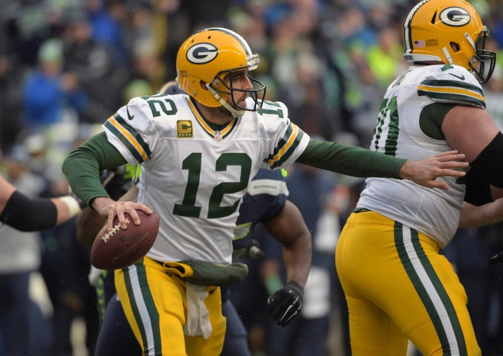 Jan 18, 2015; Seattle, WA, USA; Green Bay Packers quarterback Aaron Rodgers (12) looks to throw the ball against the Seattle Seahawks during the fourth quarter in the NFC Championship Game at CenturyLink Field.
