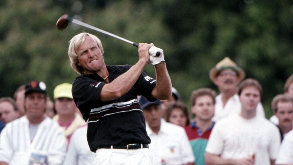Mar 1990; Miami, FL, USA; FILE PHOTO; Greg Norman follows through his swing on the tee box during the 1990 Doral Ryder Open at the Doral Country Club. Greg Norman would go on to win the the tournament with a score of -15.