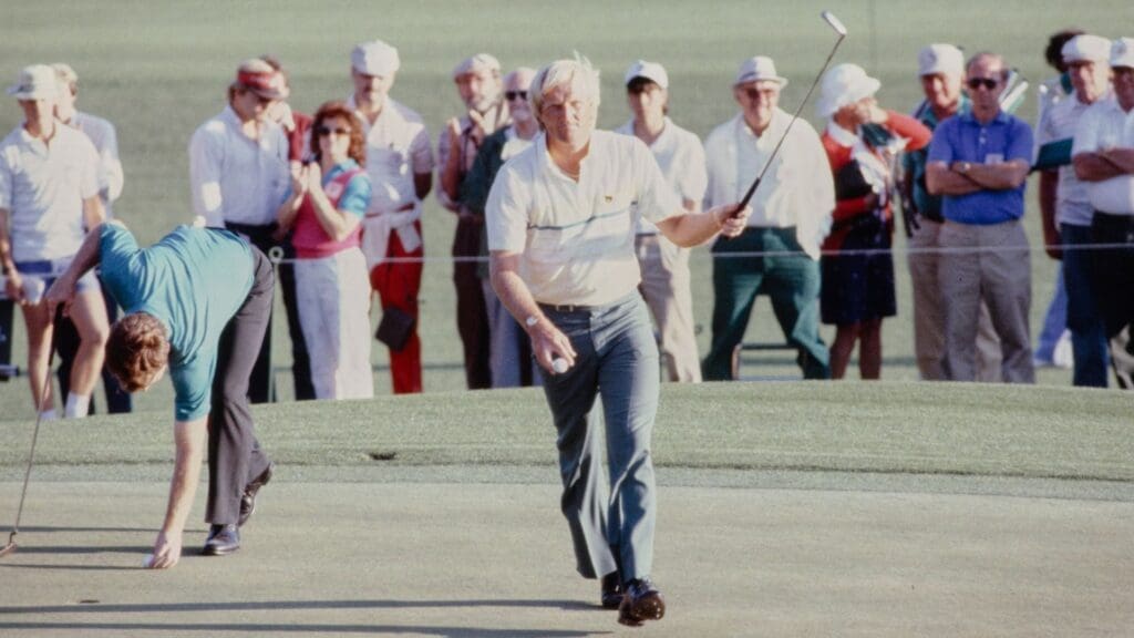 04/11/1986; Augusta, Georgia, USA; Greg Norman walks off the greeen after putting while Tom Watson places his ball on a marker at the Augusta National Golf Course during the 1986 Masters.