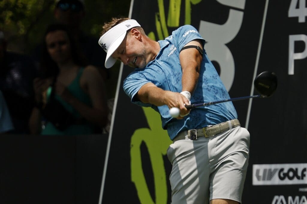 Jun 6, 2025; Gainesville, Virginia, USA; Ian Poulter of team Majesticks GC hits a tee shot on the third hole during the first round of the LIV Golf Virginia golf tournament at Robert Trent Jones Golf Club