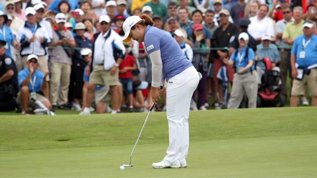 Jun 28, 2013; Southampton, NY, USA; Inbee Park (KOR) taps in for par on the eighteenth hole during the final round of the U.S. Women's Open at Sebonack Golf Course. Park finished the tournament in first place.