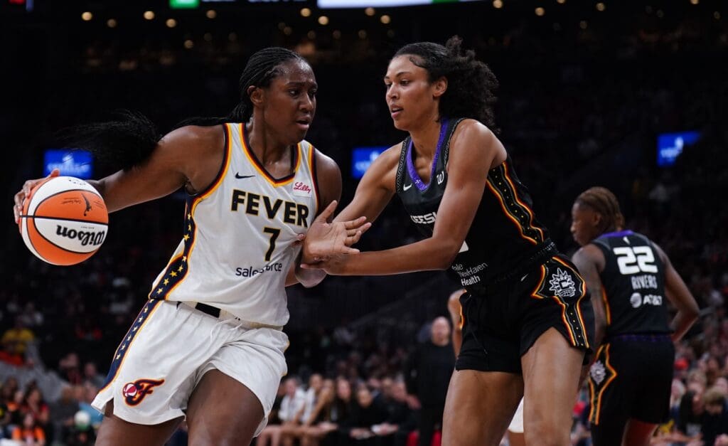 Jul 15, 2025; Boston, Massachusetts, USA; Indiana Fever forward Aliyah Boston (7) moves the ball against Connecticut Sun center Olivia Nelson-Ododa (10) in the second quarter at TD Garden.