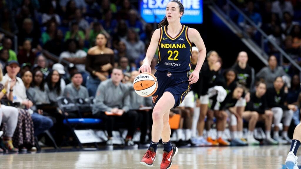 May 3, 2024; Dallas, Texas, USA; Indiana Fever guard Caitlin Clark (22) controls the ball during the first quarter against the Dallas Wings at College Park Center.