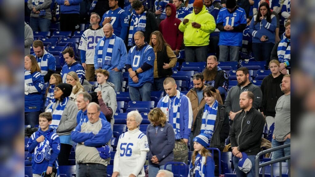 Indianapolis Colts fans stand during a moment of silence Sunday, Jan. 5, 2025, during a game against the Jacksonville Jaguars at Lucas Oil Stadium in Indianapolis.