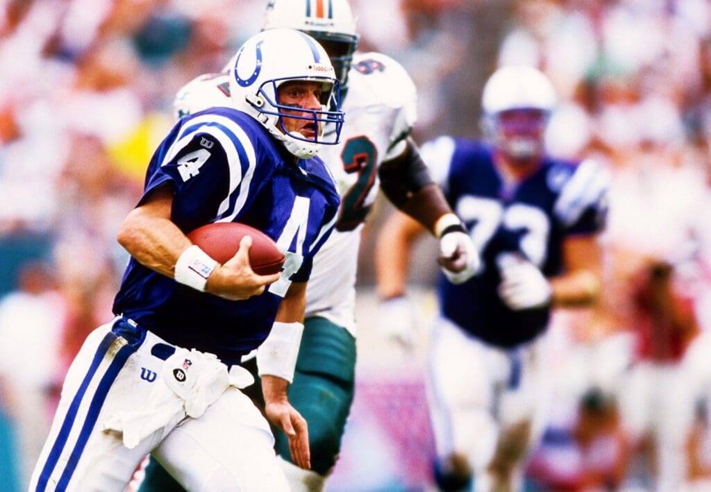 Aug 31, 1997; Miami, FL, USA; Indianapolis Colts quarterback Jim Harbaugh (4) in action against Miami Dolphins defensive tackle Daryl Gardener (92) at Pro Player Stadium. 