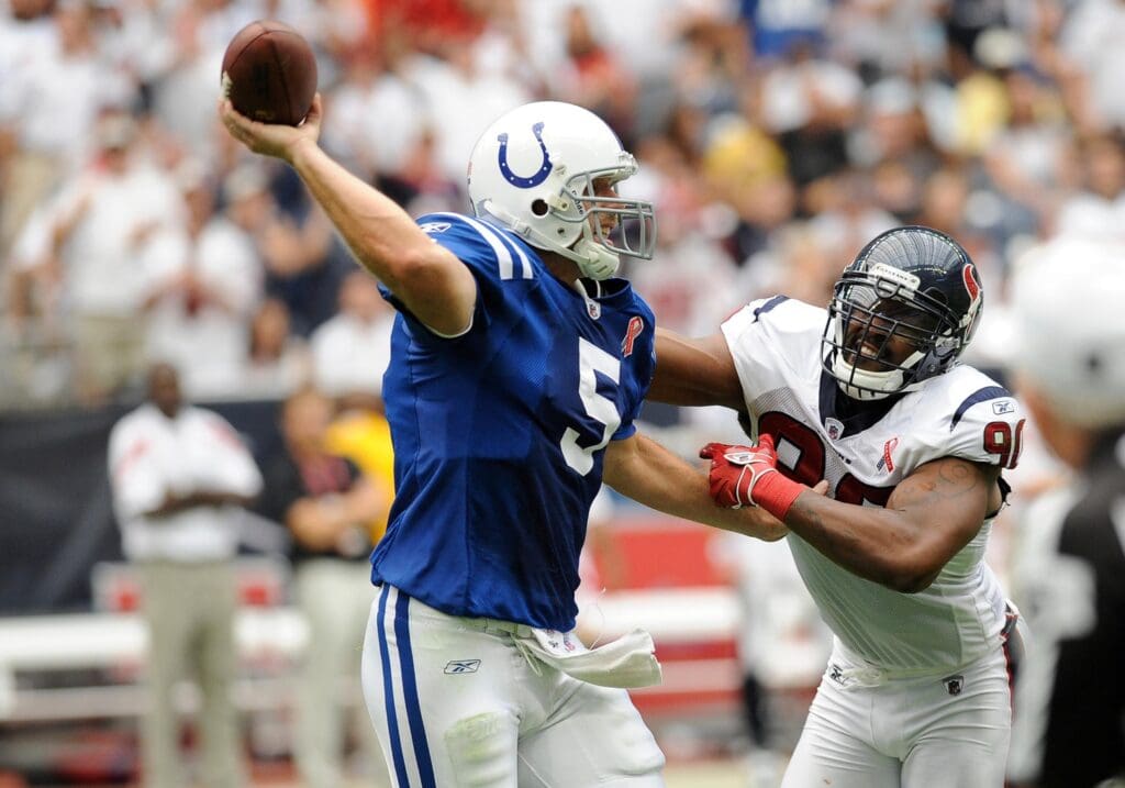 Sep 11, 2011; Houston, TX, USA; Indianapolis Colts quarterback Kerry Collins (5) is pressured by Houston Texans linebacker Mario Williams (90) during the game at Reliant Stadium. The Texans defeated the Colts 34-7.