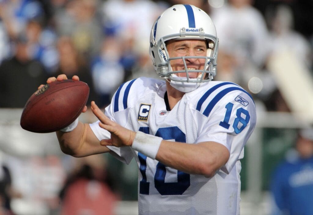 Dec 26, 2010; Oakland, CA, USA; Indianapolis Colts quarterback Peyton Manning (18) throws a pass against the Oakland Raiders at the Oakland-Alameda County Coliseum. The Colts defeated the Raiders 31-26. 