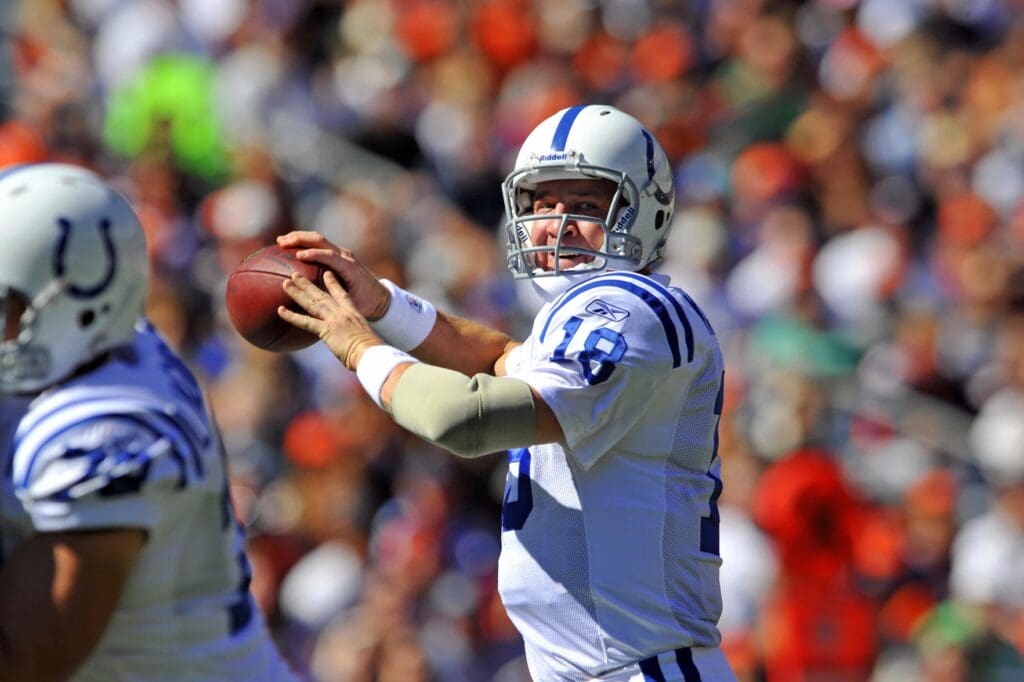 Sept 26, 2010; Denver, CO, USA; Indianapolis Colts quarterback Peyton Manning (18) prepares to throw in the first quarter against the Denver Broncos at Invesco Field.
