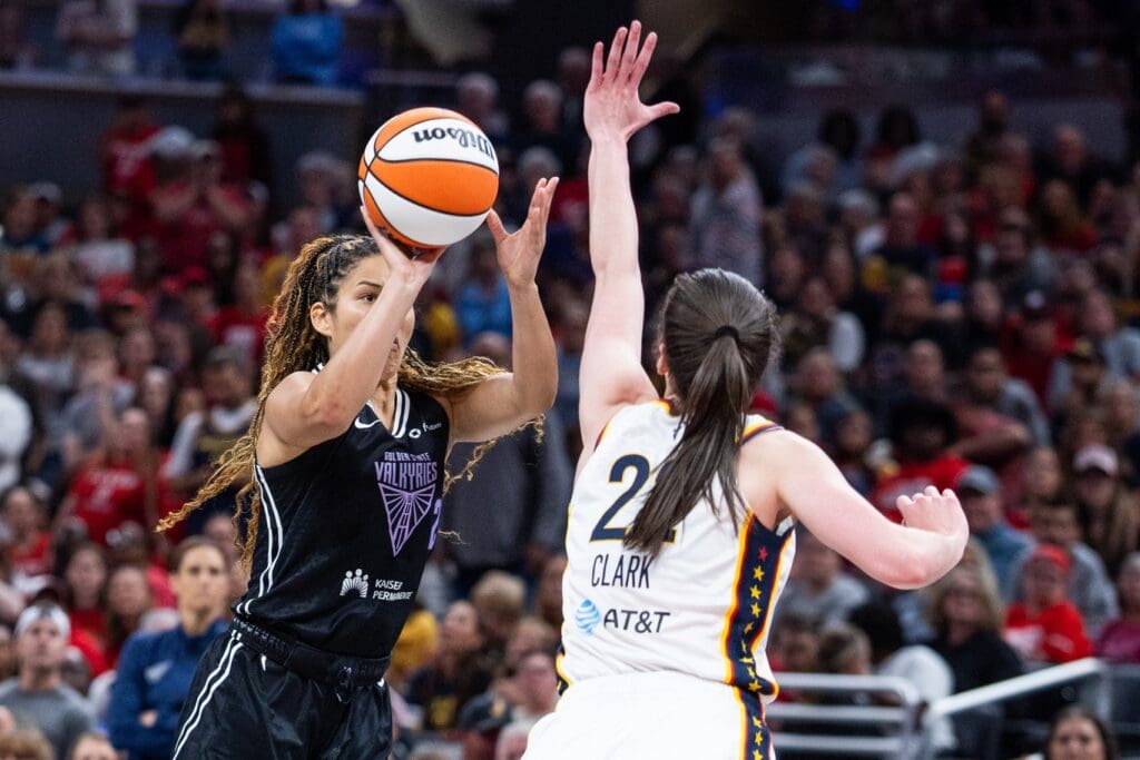 Jul 9, 2025; Indianapolis, Indiana, USA; Golden State Valkyries guard Veronica Burton (22) shoots the ball while Indiana Fever guard Caitlin Clark (22) defends in the second half at Gainbridge Fieldhouse.