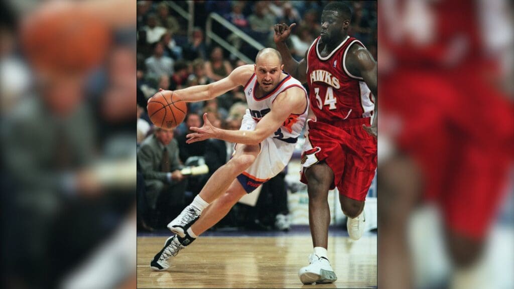 DATE UNKNOWN; Phoenix, AZ, USA; FILE PHOTO; Sun's Rex Chapman drives baseline against Hawk's Isaiah Rider in game at America West Arena