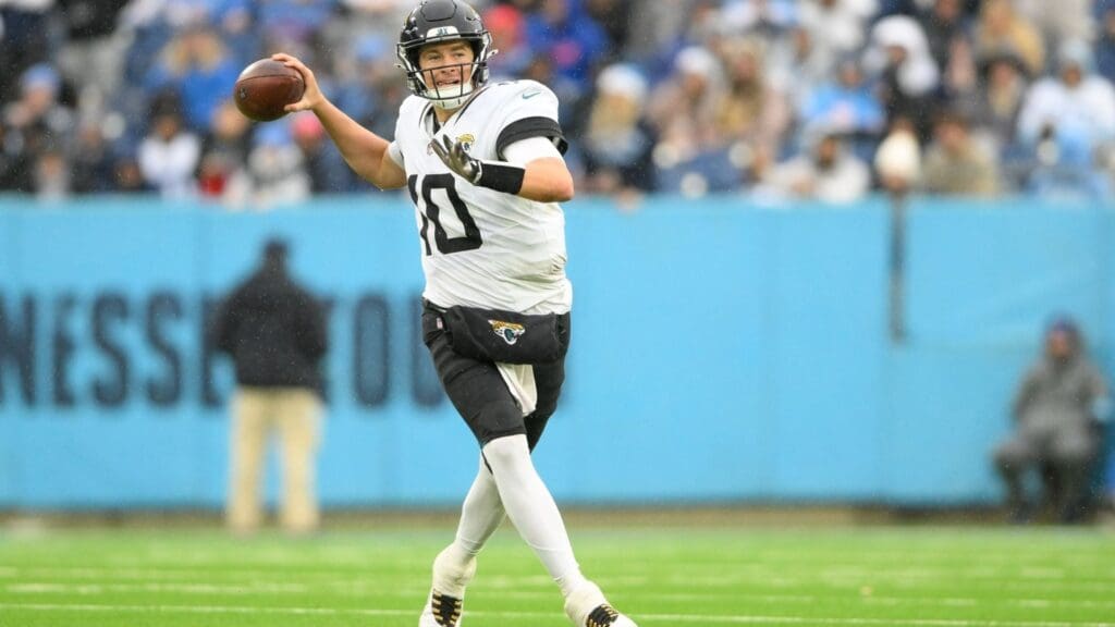 Dec 8, 2024; Nashville, Tennessee, USA; Jacksonville Jaguars quarterback Mac Jones (10) gets flushed from the pocket against the Tennessee Titans during the second half at Nissan Stadium.