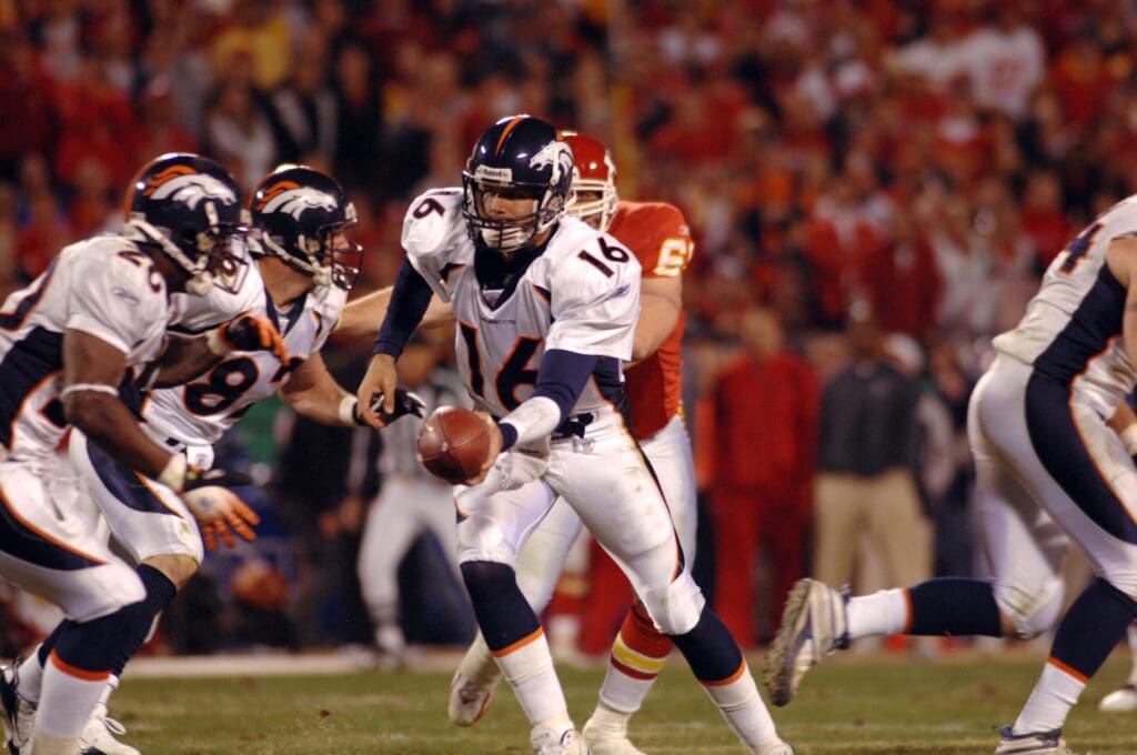 Nov 23, 2006; Kansas City, MO, USA; Denver Broncos quarterback (16) Jake Plummer hands off to Denver Broncos running back (20) Mike Bell in the fourth quarter at Arrowhead Stadium in Kansas City, MO. The Chiefs won 19-10.