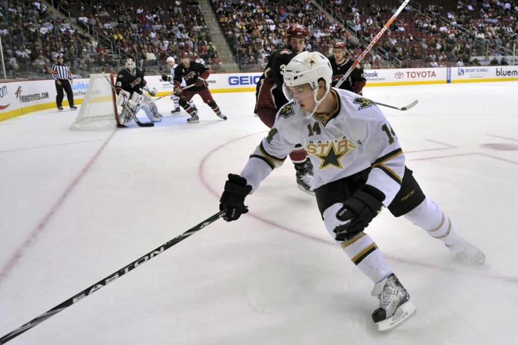Nov. 27, 2009; Glendale, AZ, USA; Dallas Stars left wing Jamie Benn (14) goes for the puck during the second period against the Phoenix Coyotes at Jobing.com Arena.
