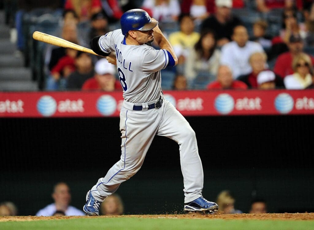 July 3, 2010; Anaheim, CA, USA; Kansas City Royals catcher Jason Kendall (18) hits a single in the ninth inning against the Los Angeles Angels at Angel Stadium of Anaheim. The Royals defeat the Angels 4-2.