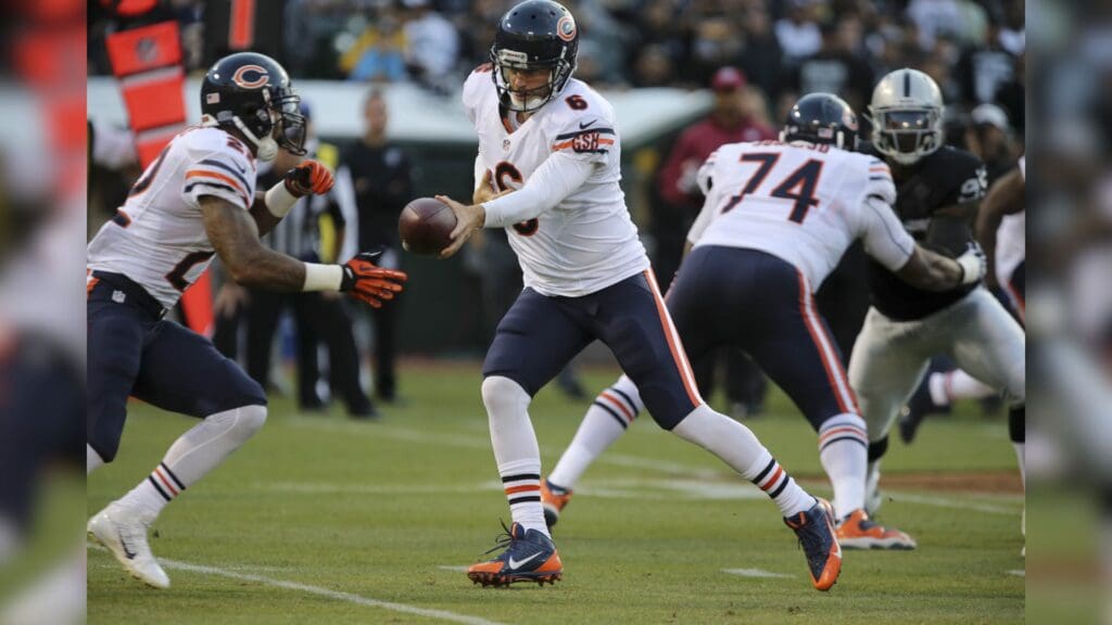 Aug 23, 2013; Oakland, CA, USA; Chicago Bears quarterback Jay Cutler (6) hands off the ball to running back Matt Fort (22) against the Oakland Raiders during the first quarter at O.co Coliseum.