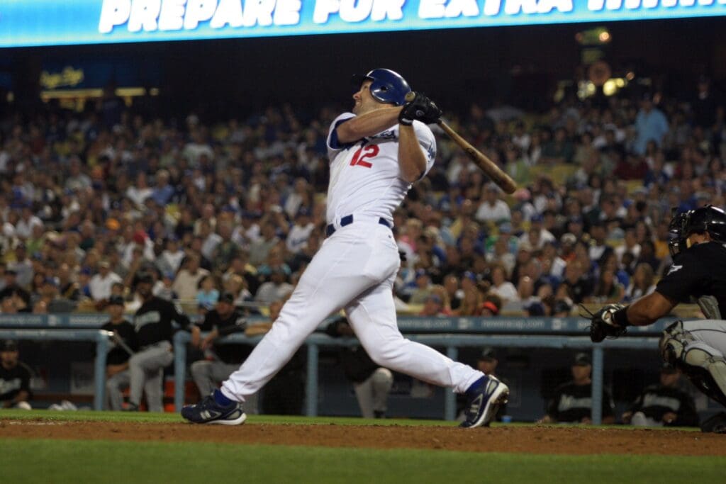 July 6, 2007; Los Angeles, CA, USA; Los Angeles Dodgers second baseman Jeff Kent (12) hits a single in the fourth inning against the Florida Marlins at Dodger Stadium.