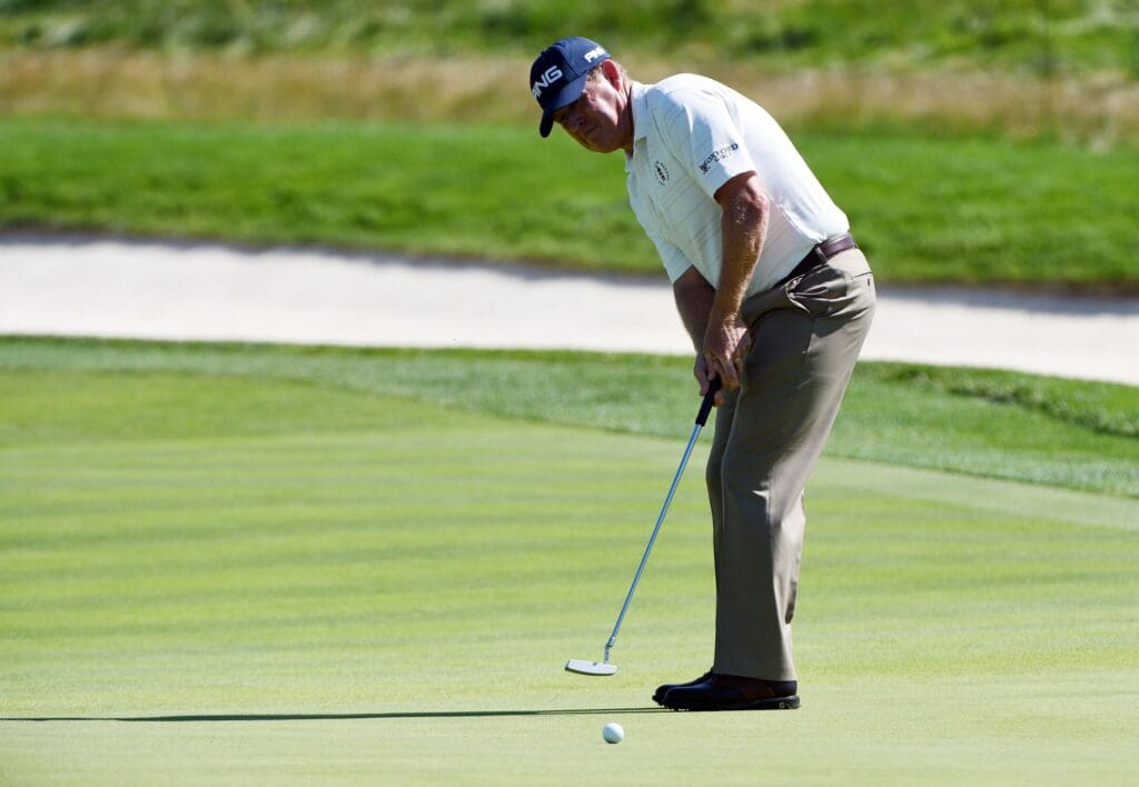 Jun 18, 2016; Oakmont, PA, USA; Jeff Maggert putts on the 8th green during the continuation of the second round of the U.S. Open golf tournament at Oakmont Country Club.