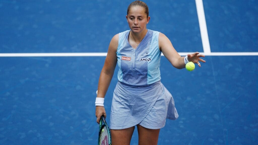 Aug 27, 2024; Flushing, NY, USA; Jelena Ostapenko of Latvia in action against Naomi Osaka of Japan in the first round of the women’s singles in the US Open at the USTA Billie Jean King Tennis Center. 