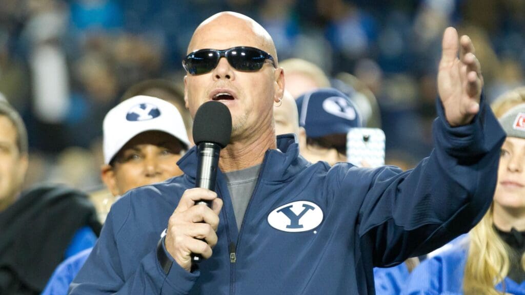 Oct 3, 2014; Provo, UT, USA; Brigham Young Cougars and NFL former quarterback Jim McMahon speaks during a ceremony in his honor during halftime of the game between the Brigham Young Cougars and the Utah State Aggies at Lavell Edwards Stadium. Utah State won 35-20.