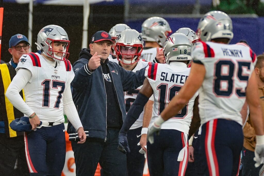 Nov 26, 2023; East Rutherford, New Jersey, USA; New England Patriots assistant head coach Joe Judge talks with players during the second half against the New York Giants at MetLife Stadium.