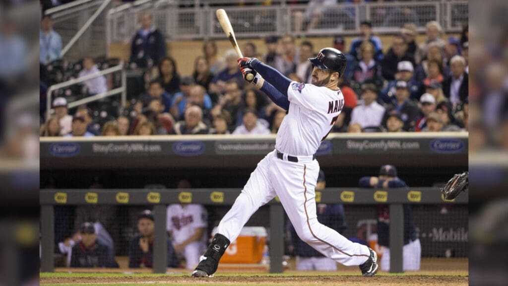 Apr 27, 2015; Minneapolis, MN, USA; Minnesota Twins first baseman Joe Mauer (7) hits a double in the eighth inning against the Detroit Tigers at Target Field. The Tigers won 5-4.