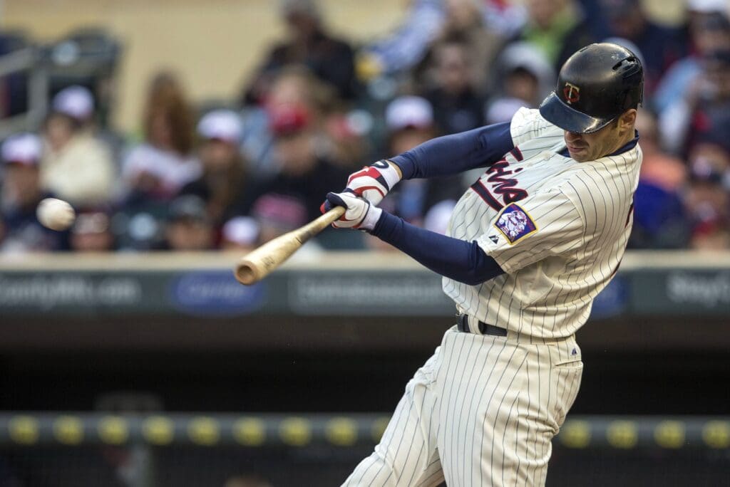 May 11, 2013; Minneapolis, MN, USA; Minnesota Twins catcher Joe Mauer (7) hits a single in the first inning against the Baltimore Orioles at Target Field.