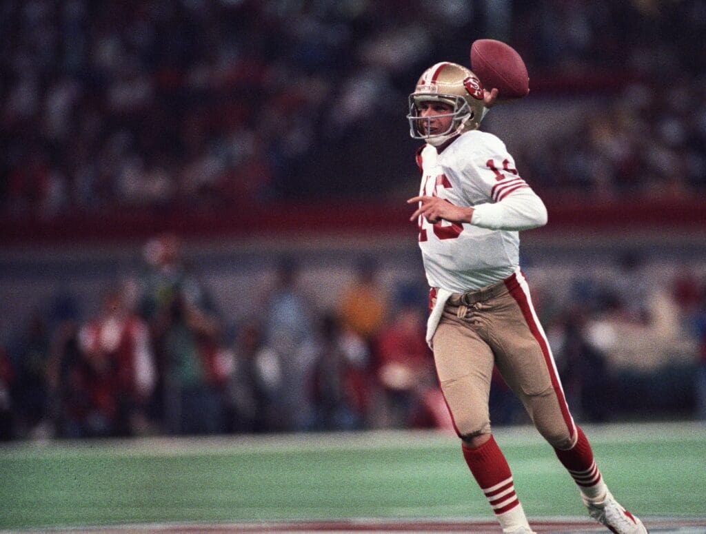 Jan 28, 1990; New Orleans, LA, USA; FILE PHOTO; San Francisco 49ers quarterback Joe Montana (16) looks to throw against the Denver Broncos during Super Bowl XXIV at the Superdome. The 49ers defeated the Broncos 55-10.