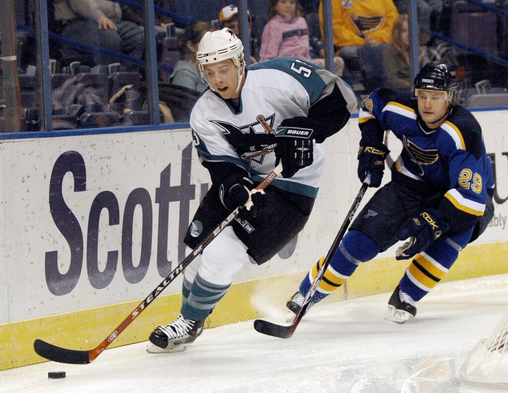Nov 28, 2006; St. Louis, MO, USA; San Jose Sharks forward (53) Joe Pavelski skates behind the net as St. Louis Blues defenseman (29) Matt Walker follows during the first period at the Savvis Center in St. Louis, MO.