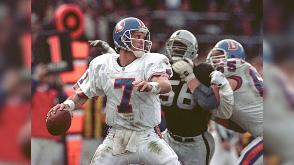 Dec 24, 1995; Oakland, CA, USA; Denver Broncos quarterback John Elway (7) throws a pass against the Oakland Raiders at Oakland-Alameda County Coliseum. The Broncos defeated the Raiders 31-28.