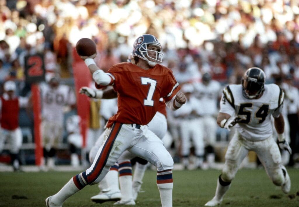 Oct 8, 1989; Denver, CO, USA; FILE PHOTO; Denver Broncos quarterback John Elway (7) makes a pass against the San Diego Chargers at Mile High Stadium.