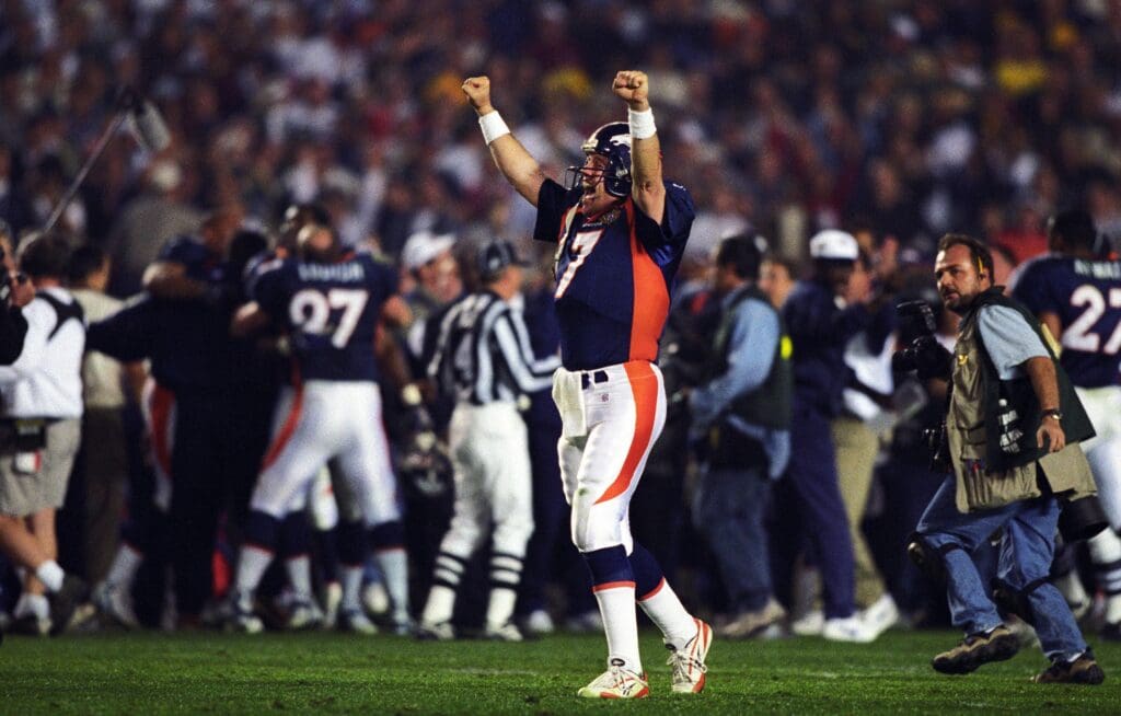 Jan 25, 1998; San Diego, CA, USA; FILE PHOTO; Denver Broncos quarterback John Elway (7) reacts on the field against the Denver Broncos during Super Bowl XXXII at Qualcomm Stadium. The Broncos defeated the Packers 31-24.