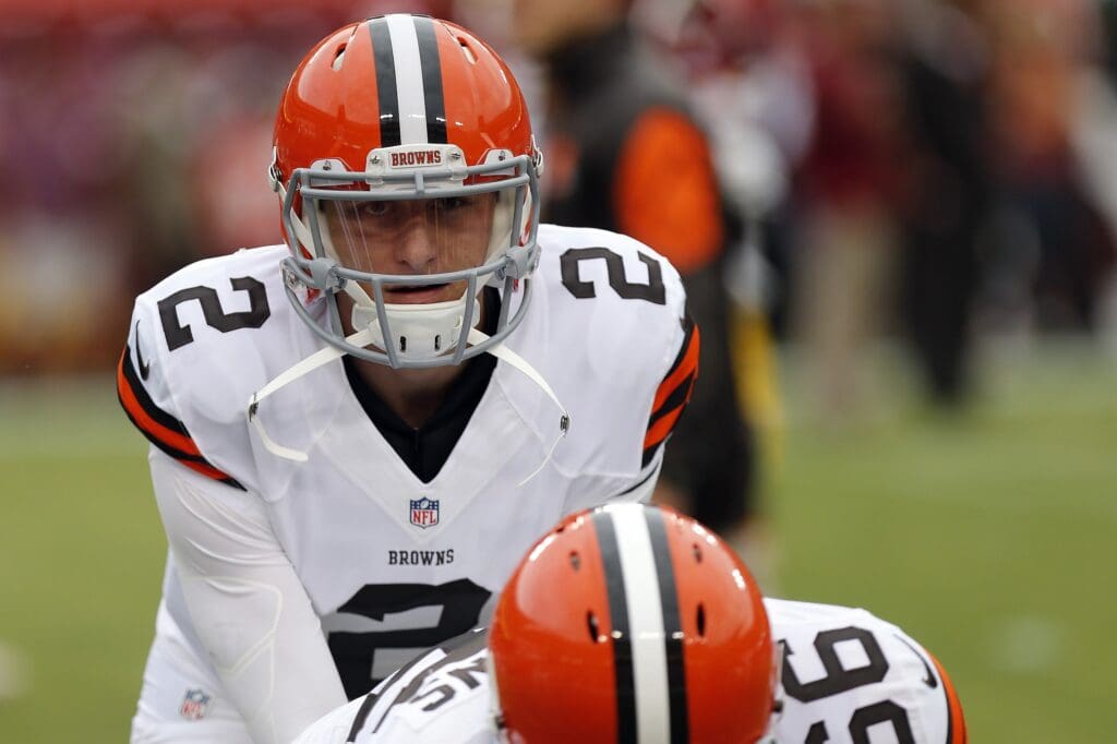 Aug 18, 2014; Landover, MD, USA; Cleveland Browns quarterback Johnny Manziel (2) takes a snap during warmups prior to the Browns' game against the Washington Redskins at FedEx Field.