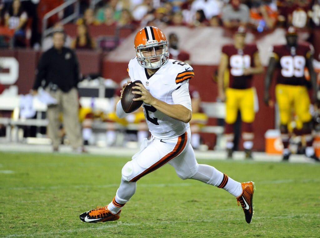 Aug 18, 2014; Landover, MD, USA; Cleveland Browns quarterback Johnny Manziel (2) rolls out against the Washington Redskins during the second half at FedEx Field.