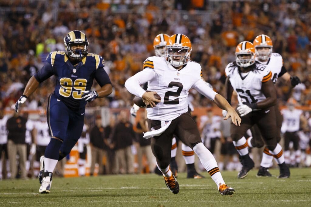 Aug 23, 2014; Cleveland, OH, USA; Cleveland Browns quarterback Johnny Manziel (2) runs in for a touchdown in the third quarter against the St. Louis Rams at FirstEnergy Stadium.