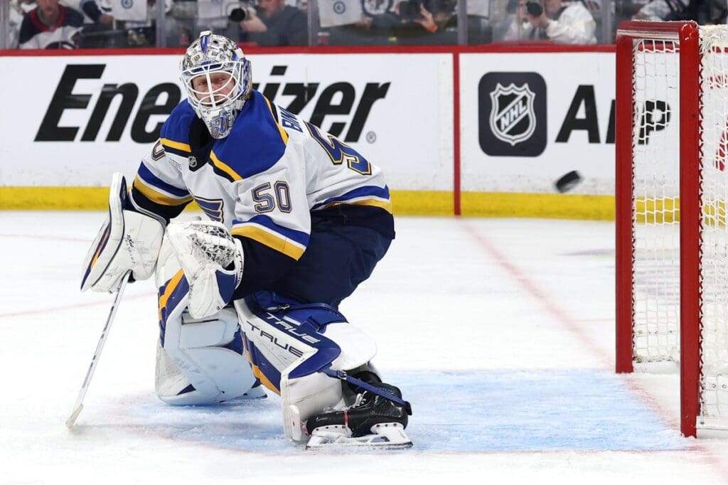 May 4, 2025; Winnipeg, Manitoba, CAN; St. Louis Blues goaltender Jordan Binnington (50) eyes the puck against the Winnipeg Jets in the second period in game seven of the first round of the 2025 Stanley Cup Playoffs at Canada Life Centre.