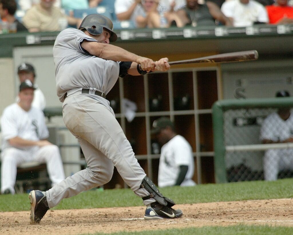 Aug 20, 2005; Chicago, IL, USA; New York Yankees catcher #20 Jorge Posada hits a double in the 7th inning at US Cellular Field. The hit was the 1,000th hit of his career. The Yankees defeated the White Sox 5-0.