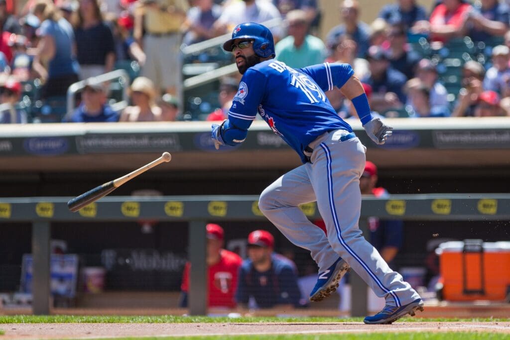 May 22, 2016; Minneapolis, MN, USA; Toronto Blue Jays outfielder Jose Bautista (19) hits a home run in the first inning against the Minnesota Twins at Target Field.