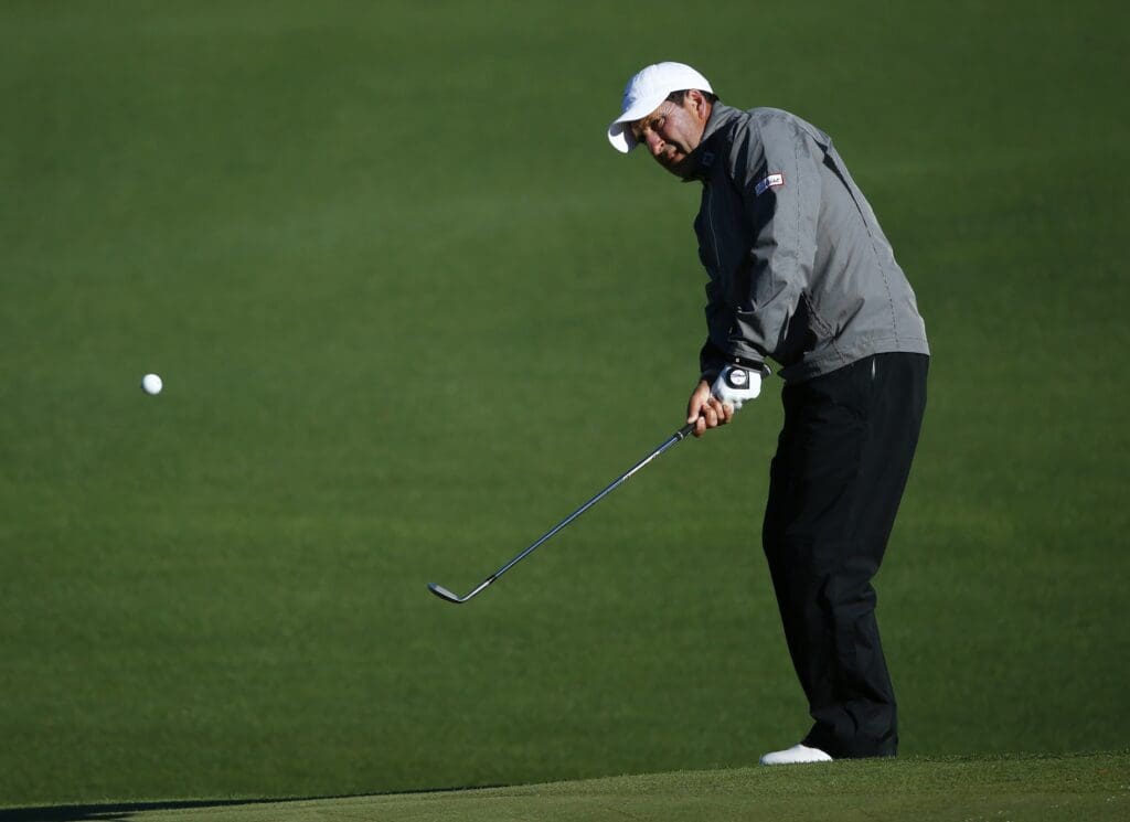 Apr 7, 2017; Augusta, GA, USA; Jose Maria Olazabal chips onto the 2nd green during the second round of The Masters golf tournament at Augusta National Golf Club. 