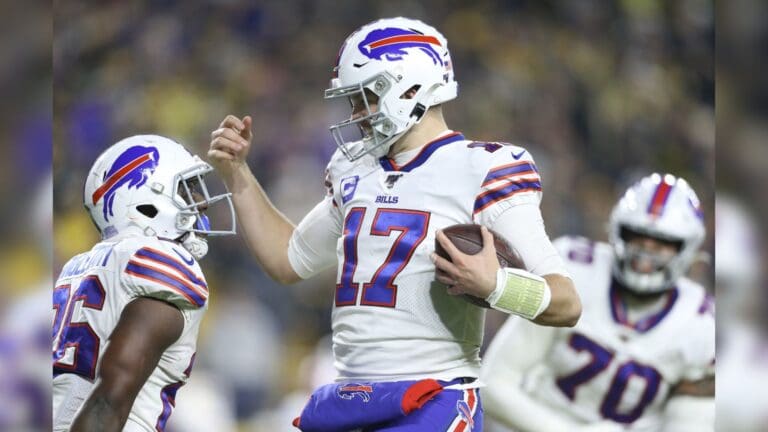 Dec 15, 2019; Pittsburgh, PA, USA; Buffalo Bills quarterback Josh Allen (17) celebrates his touchdown with running back Devin Singletary (26) against the Pittsburgh Steelers during the second quarter at Heinz Field.