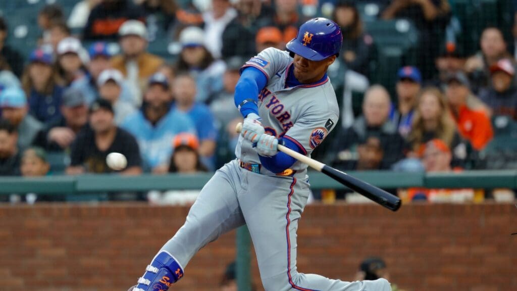 Jul 25, 2025; San Francisco, California, USA; New York Mets right fielder Juan Soto (22) hits a RBI ground out during the first inning against the San Francisco Giants at Oracle Park. Mandatory Credit: