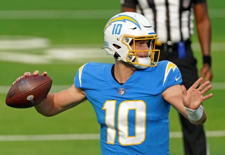 Dec 27, 2020; Inglewood, California, USA; Los Angeles Chargers quarterback Justin Herbert (10) throws a pass against the Denver Broncos during the first half at SoFi Stadium.