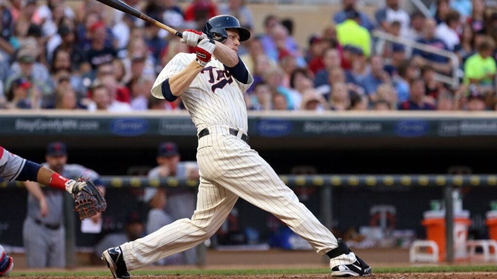 Jul 20, 2013; Minneapolis, MN, USA; Minnesota Twins first baseman Justin Morneau (33) hits a single in the sixth inning against the Cleveland Indians at Target Field.