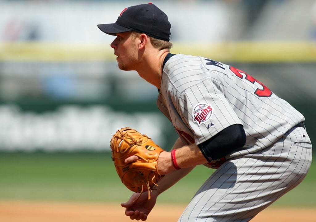 July 26, 2006; Chicago, IL, USA; Minnesota Twins first baseman Justin Morneau (33) fields his position during the fifth inning at US Cellular Field in Chicago, IL.