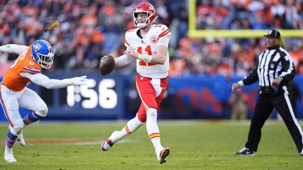 Jan 5, 2025; Denver, Colorado, USA; Kansas City Chiefs quarterback Carson Wentz (11) looks to pass the ball in the second quarter against the Denver Broncos at Empower Field at Mile High. 