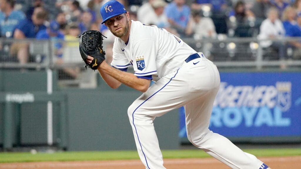Jun 4, 2021; Kansas City, Missouri, USA; Kansas City Royals relief pitcher Wade Davis (71) checks a runner at first base before pitching in the eighth inning against the Minnesota Twins at Kauffman Stadium.